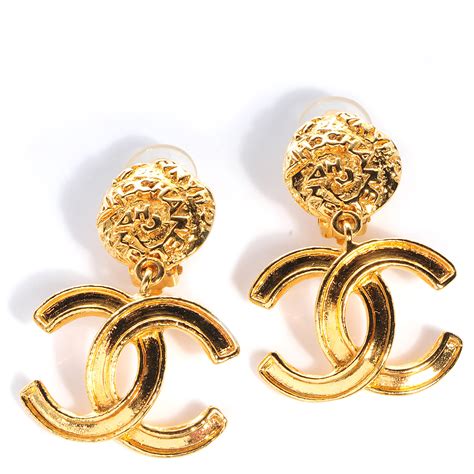 chanel 5 gold earrings.